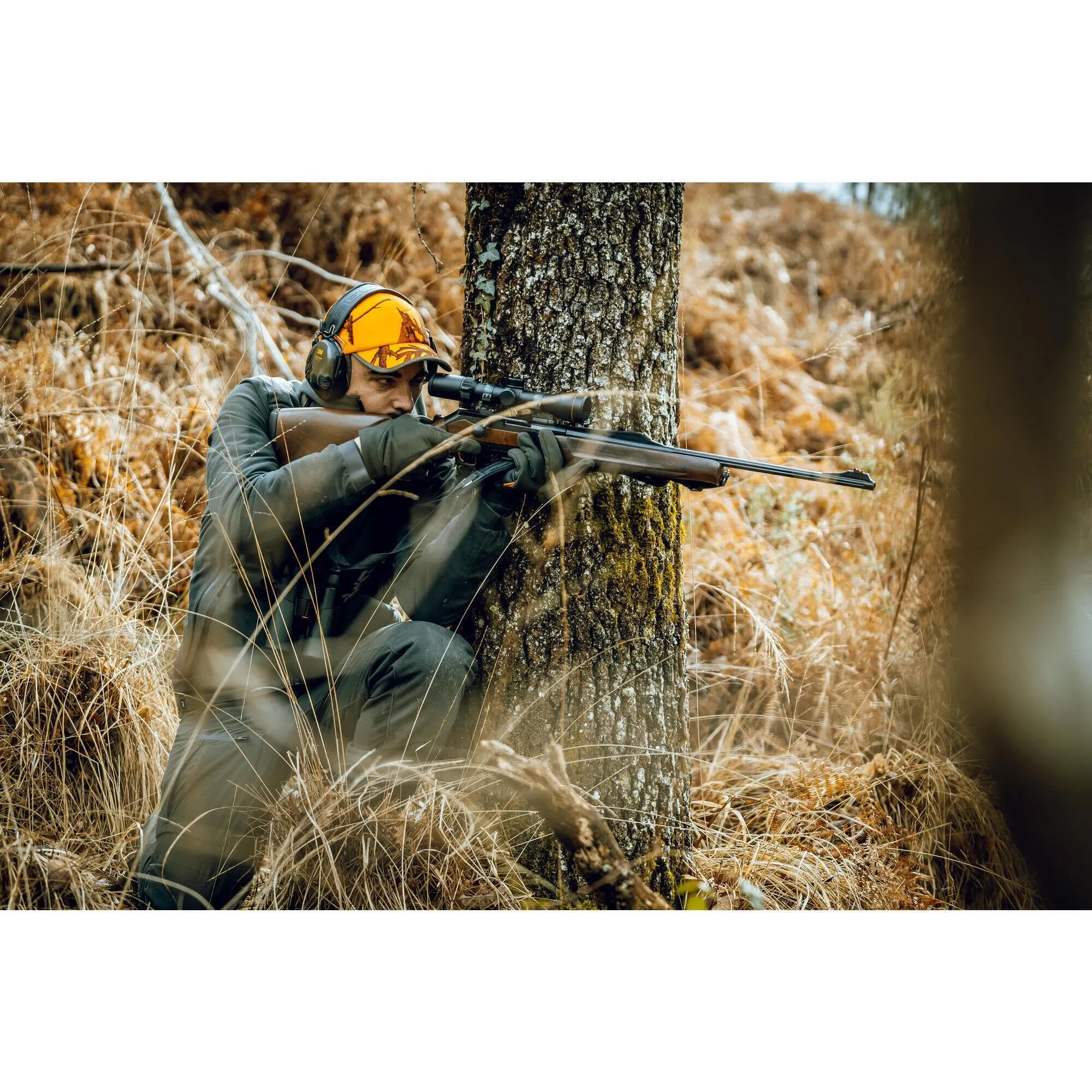 Hunting cap with earflaps camouflage orange SOLOGNAC, neon orange psa